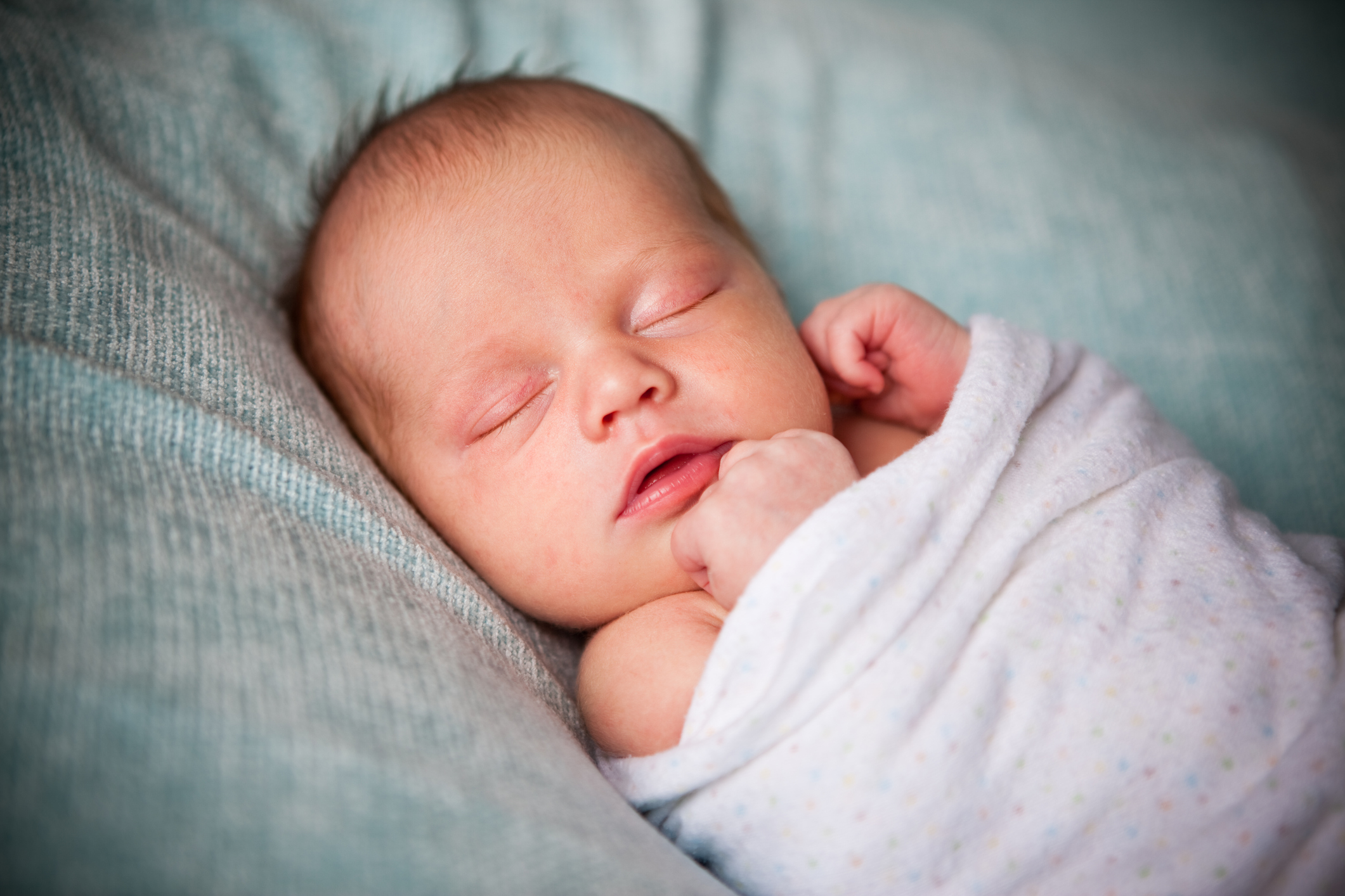 Newborn sleeping in boppy lounger shop
